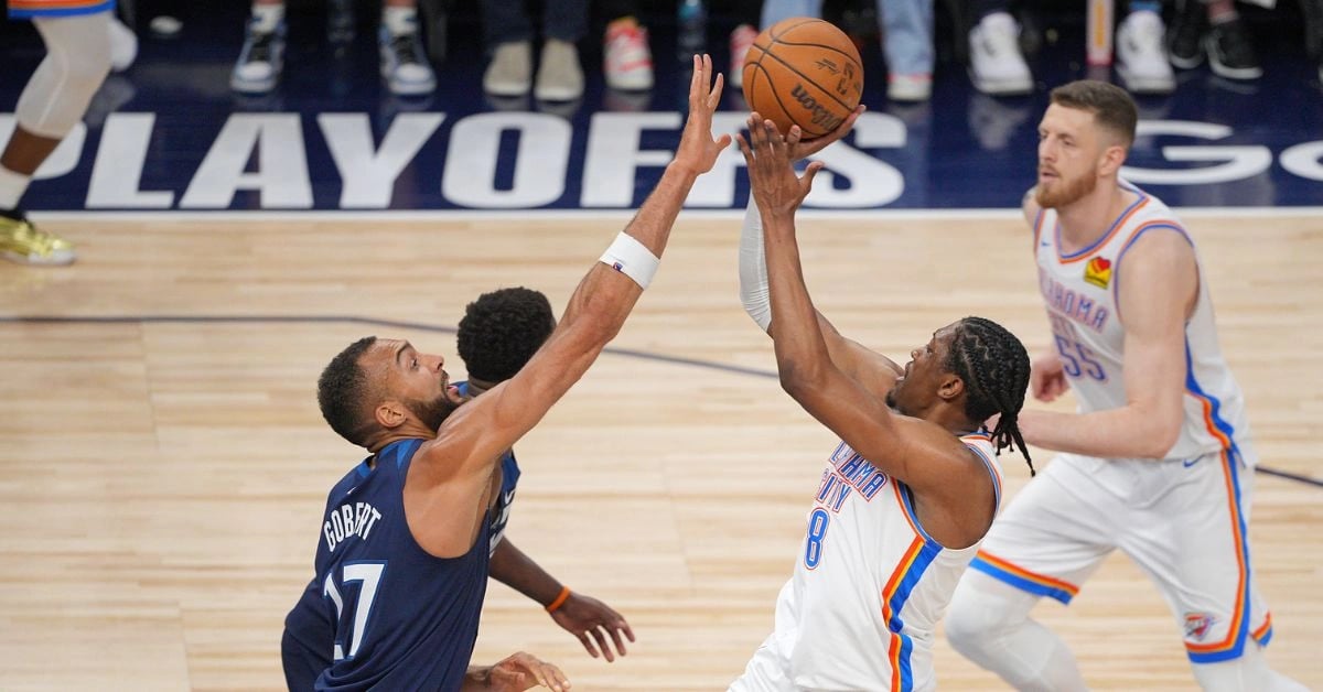 Oklahoma City Thunder forward Jalen Williams shoots the ball past Minnesota Timberwolves center Rudy Gobert