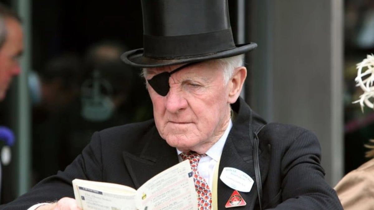 How to Read a Racecard and Use It to Your Advantage sports bettor reading a racecard