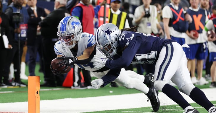 Detroit Lions wide receiver Amon-Ra St. Brown (14) scores a touchdown against Dallas Cowboys cornerback Stephon Gilmore (21).