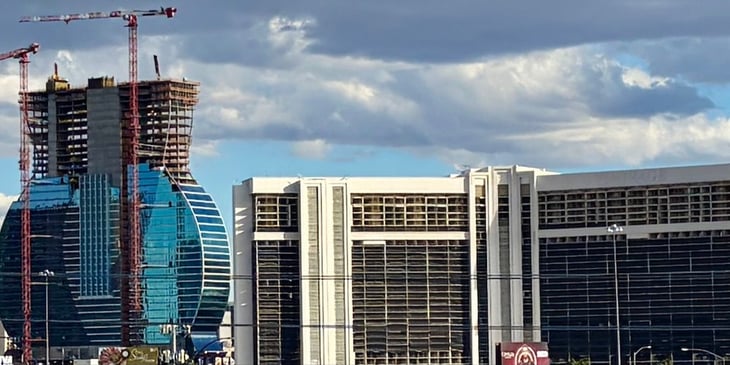 The Hard Rock guitar hotel tower next to the gutted formerly Mirage hotel tower